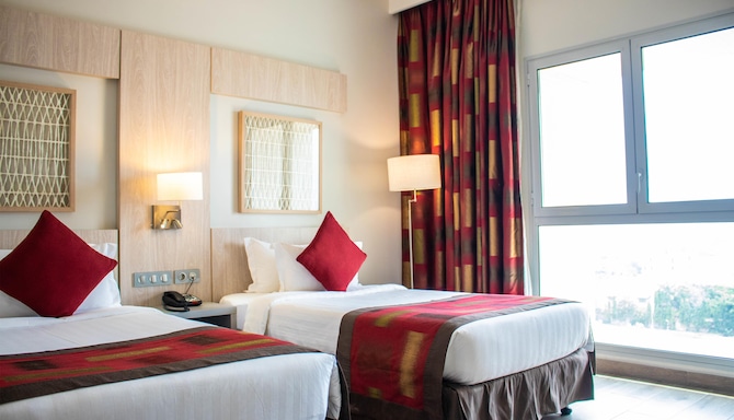 GOLDEN TULIP LE DIPLOMATE COTONOU - Chambres / Logements