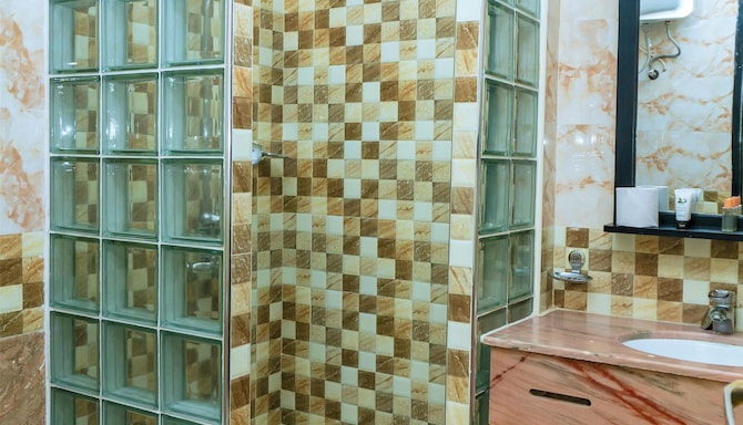 Golden Tulip Zanzibar Boutique - Salle de bain de la chambre