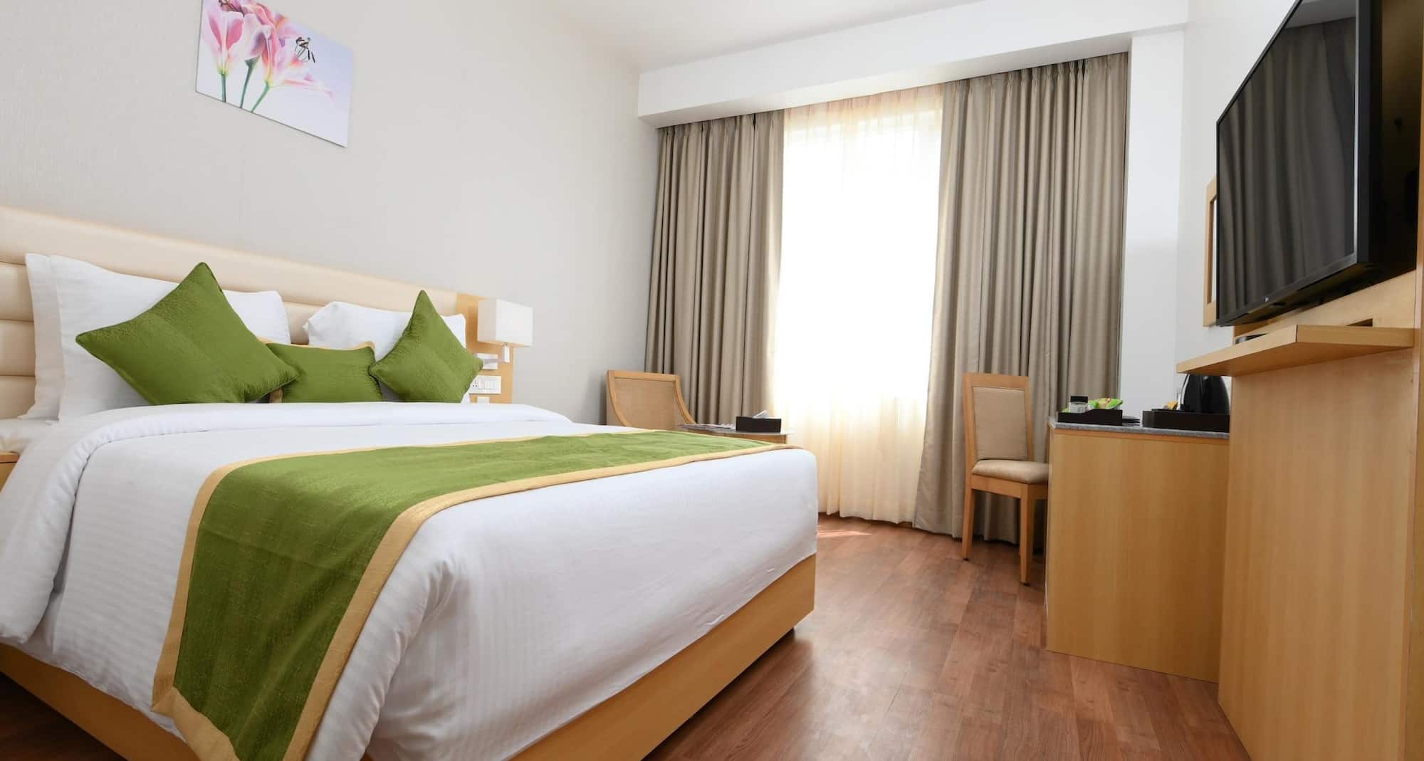 Pushkara Sarovar Portico Dibrugarh - DELUXE ROOM