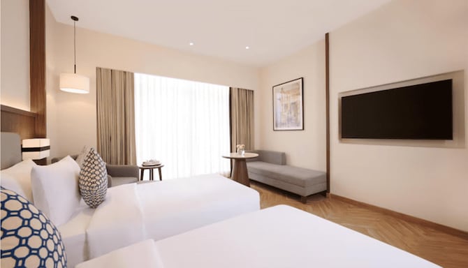 Skywings Sarovar Portico Mathura - DELUXE ROOM TWIN BED Skywings Sarovar Portico Mathura